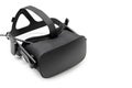 VR virtual reality headset half turned on white background. Gaming future device, virtual reality glasses. Copy space for