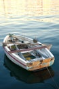 Old small wooden boat at sunset