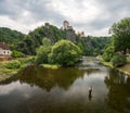 Vranov nad Dyji castle from below in the background and a fisherman in the foreground