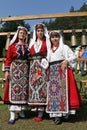 People in traditional authentic folk costumes on National folklore fair `Ledenika`