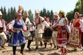 People in traditional authentic folk costumes on National folklore fair `Ledenika`