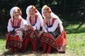 People in traditional authentic folklore costume a meadow near Vratsa, Bulgaria