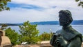 Vrbnik - A statute of a man vith the sea view