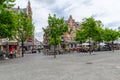 Vrijdagmarkt Friday Market Square with tourists seating on terraces in the historic city center of Gent,Belgium