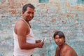 Vrindavan, 22 October 2016: Barber working on the street, in Vrindavan, UP