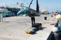 8. 28. 2012. Vrsar. Croatia. Diver checks air tanks for scuba diving on the pier. Full oxygen tanks and diving equipment