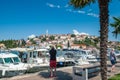 8. 28. 2012. Vrsar. Croatia. A man photographs Vrsar Harbor on the Adriatic sea in Istria, Croatia.