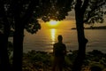 Vrsar - A girl enjoying the sunset by the beach