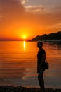 Vrsar - A girl enjoying the sunset by the beach