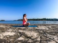 Vrsar - A girl practicing yoga by the seashore