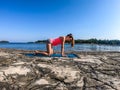 Vrsar - A girl practicing yoga by the seashore