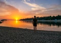 Vrsar - A young man enjoying the sunset by the beach