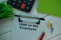 1099 Vs W2 Employee write on a paperwork isolated on office desk