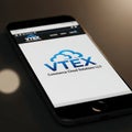 VTEX Cloud Solutions Logo on Smartphone Mockup Royalty Free Stock Photo