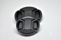 Two lens caps various sizes on the white background Royalty Free Stock Photo