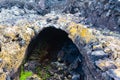 Vulcanic tunnel cave in the Lava field near to tourist walking road to vulcano Caldera Blanca, Lanzarote, Canary Islands, Spain