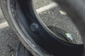 The vulcanized inner liner of a tire. A piece if rubber is visible used to plug and patch a hole