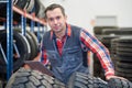 vulcanizing shop worker holding clipboard Royalty Free Stock Photo