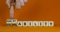 Vulnerability or adaptability symbol. Businessman turns cubes and changes words `vulnerability` to `adaptability`. Orange