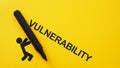 Vulnerability as Weakness Concept with Falling Figure and Marker on Yellow Background Royalty Free Stock Photo