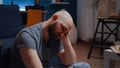 Vulnerable depressed man sitting alone feeling emotionally unstable