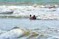 Vung Tau, Vietnam - January 26, 2018: Local residents bathe in the sea in clothes.