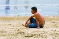 Vung Tau, Vietnam - January 30, 2018:Vietnamese man is resting on the beach.