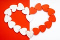 Valentine`s Day. White wooden hearts on a red background. Blank for the designer. Valentines day concept. Greeting card. Copy