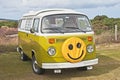 VW caravanette with smiley face