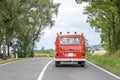 VW T1 fire engine red firefigther car Oldtimer classic car drivin on the Road
