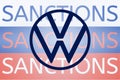 VW Volkswagen logo in front of the sanction text on the Russian flag. Fresh sanctions against Russia over its invasion