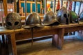 Vyborg, Russia, August 2016: Medieval exposition in the museum, helmets on the bench