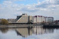 Vyborg, Russia, May 2, 2021-Hotel Druzhba in Vyborg on a cloudy day. Hotel stands on the lake shore. Reflection of the hotel in
