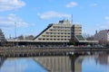 Vyborg, Russia, May 2, 2021-Hotel Druzhba in Vyborg. Hotel stands on the lake shore. Reflection of the hotel in the lake water