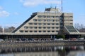 Vyborg, Russia, May 2, 2021-Hotel Druzhba in Vyborg. Hotel stands on the lake shore. Reflection of the hotel in the lake water