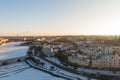 Vyborg snow-covered with an ice-bound river in the light of the rising light