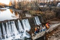 Vyhoda city, Ukraine October 29, 2021: local waterfall, Ukrainian rivers and waterfalls, a group of teenagers by the