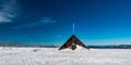 Vysoka hole hill summit with hut in winter Jeseniky mountains in Czech republic