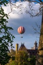 VÃÂ¡rosliget Hot Air Balloon framed by trees Royalty Free Stock Photo