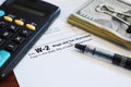 W-2 Employee Internal Revenue Service  IRS Tax Form Close Up With Cash, Pen And Calculator Royalty Free Stock Photo