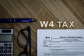 W4 Tax form Employee Withholding Certificate concept to declare multiple jobs or change withholding amount