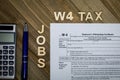 W4 Tax form Employee Withholding Certificate concept to declare multiple jobs or change withholding amount