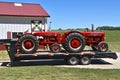 W-6 and W-9 tractors loaded on a trailer