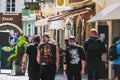 Wacken Heavy Metal fans metalheads walk in street seen from behind - Alternative music lifestyle