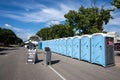 Porta potties and wash stations are set up at the IRONMAN Village