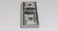 Wad of 100 dollar bills in a white background vertically Royalty Free Stock Photo