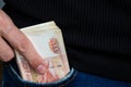 A wad of money sticking out of your jeans pocket Royalty Free Stock Photo