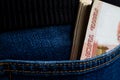 A wad of money sticking out of your jeans pocket Royalty Free Stock Photo