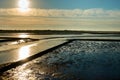 Wadden Sea of the North Sea with the sun above the clouds and view over the silt on the mainland, Sylt, Germany Royalty Free Stock Photo