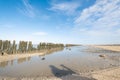 The wadden sea at paesens moddergat, wooden poles, sea and sky